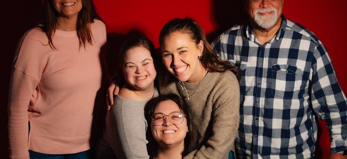 A happy family poses for a photo