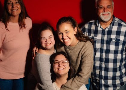 A happy family poses for a photo